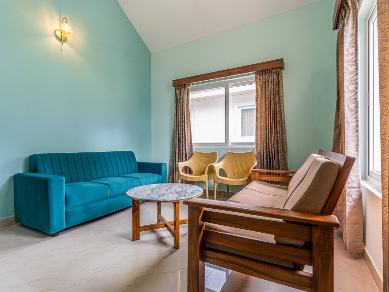Comfortable sofa and work desk in room at MSB