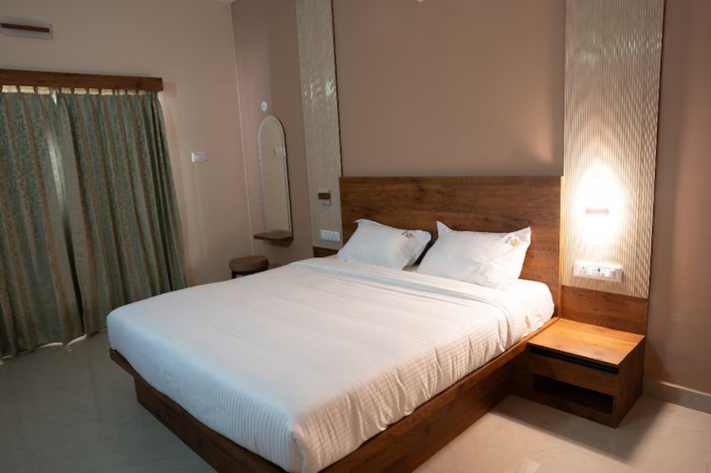 Window with curtains in an executive suite room at a resort in Yelagiri
