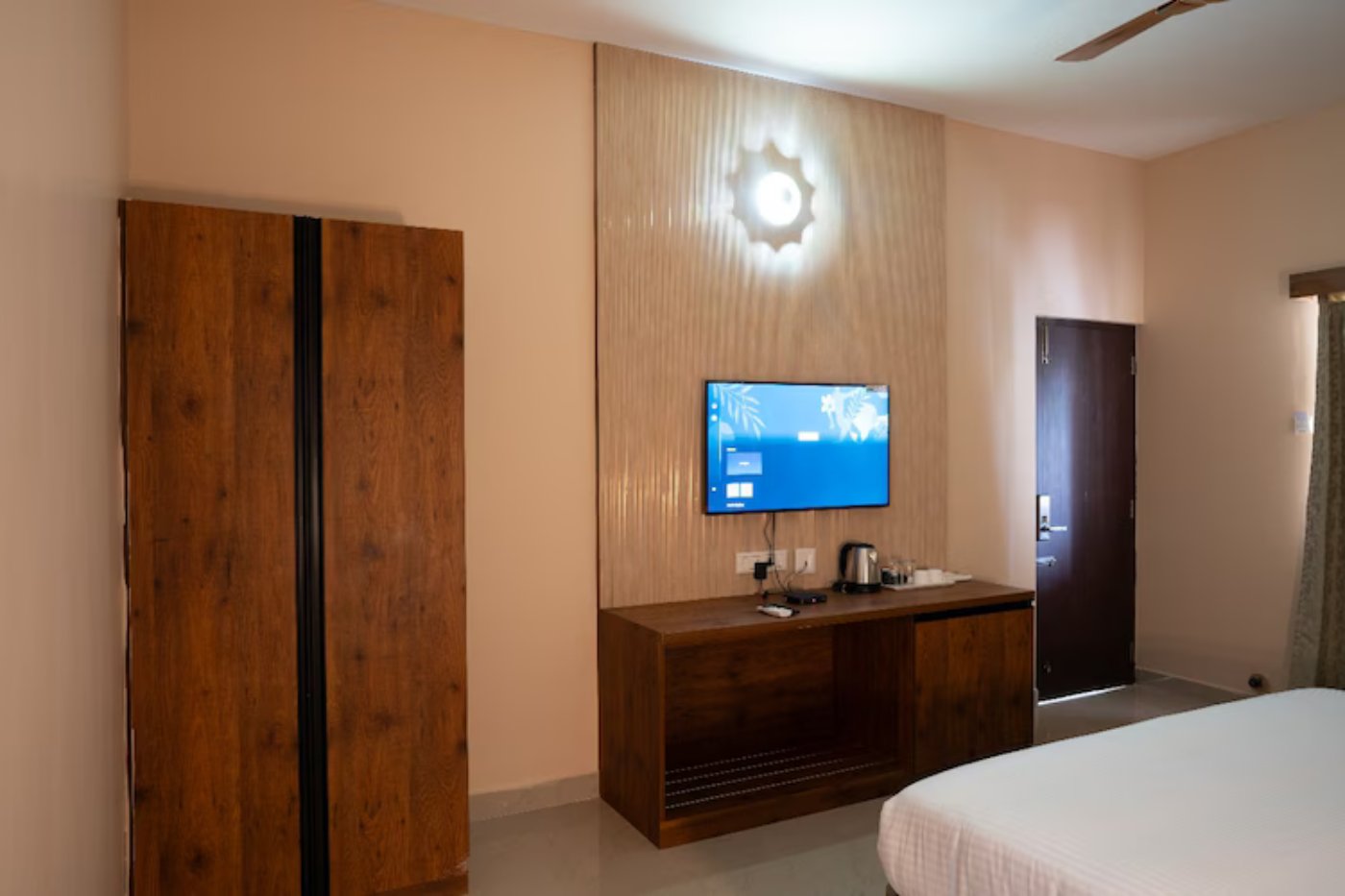 Family suite room with wardrobe and TV at MSB Silver Spring Yelagiri