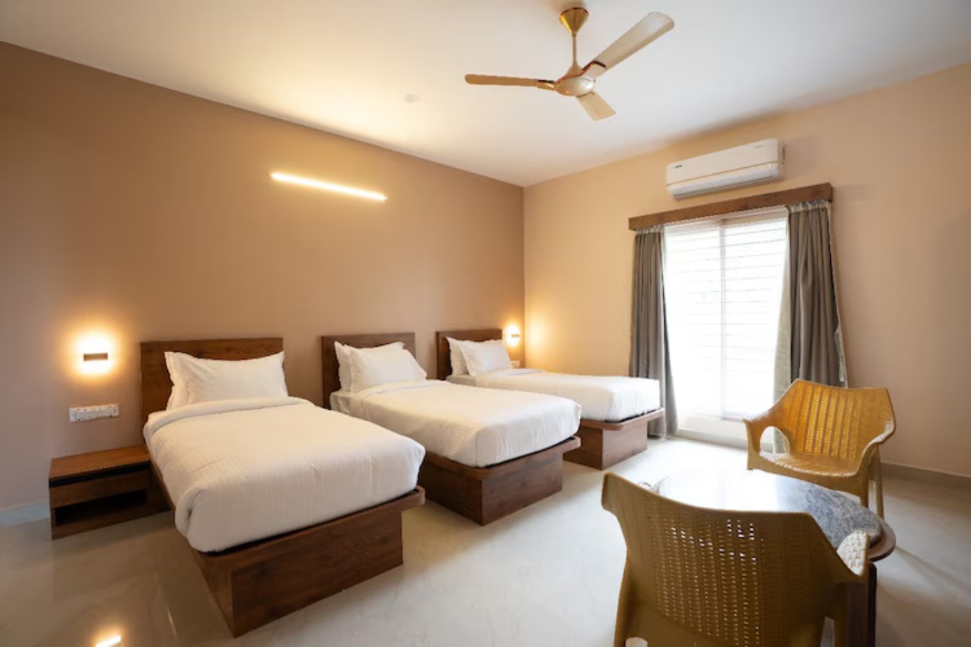 Work desk and chair in a triple suite room at MSB Silver Spring Yelagiri